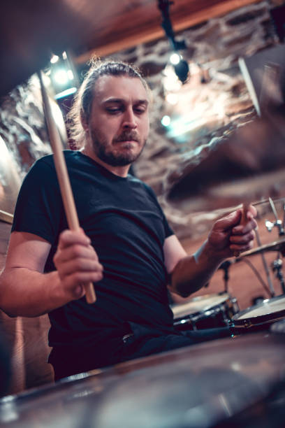 istock Male Drummer Showing His Mad Drum Skills 1204662665