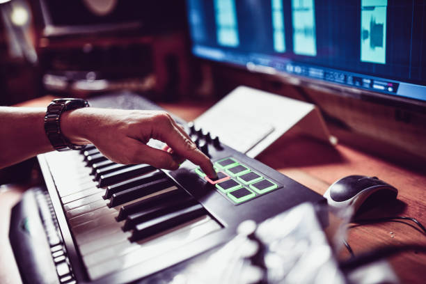 istock Producer Creating New Beats With MIDI Keyboard In Studio 1204663513