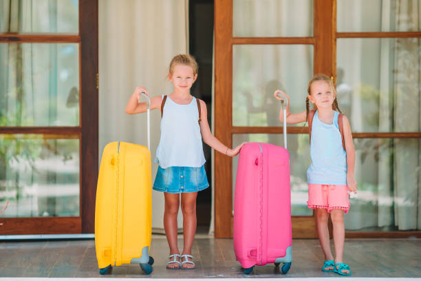 istock Kids with two luggages ready to travel 1204663790