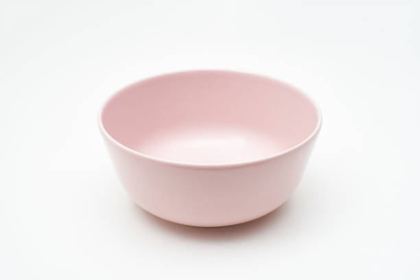 istock A pink bowl of crock isolated on white table and background 1204663822