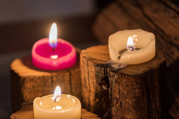istock lighted candles with ornate wood and scented and energetic incense 1204664519