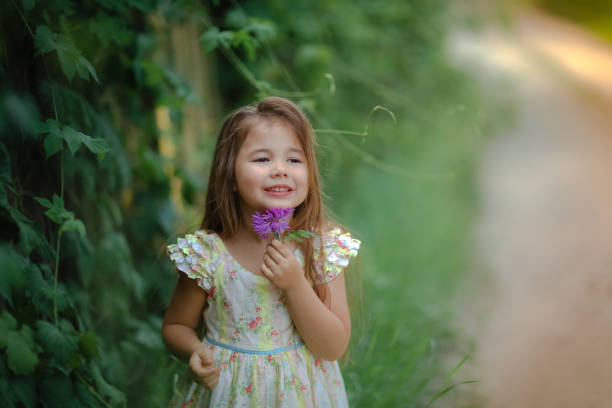 istock A child in a green garden 1204665328