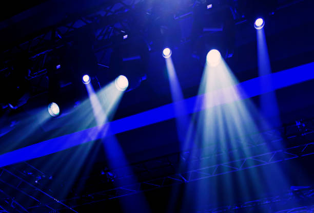 istock stage lights during an event. live concert and events. Illuminated stage 1204666943