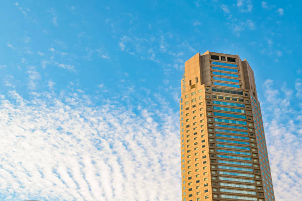 Low angle shot modern tall buildings at famous shibuya neighborhood in tokyo city, japan
