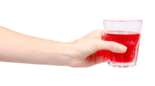 istock Red juice in glass. Isolated on white. 1204669050