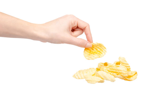 istock Yellow corrugated potato chips. Isolated on white. 1204669216