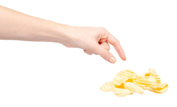 istock Yellow corrugated potato chips. Isolated on white. 1204669224
