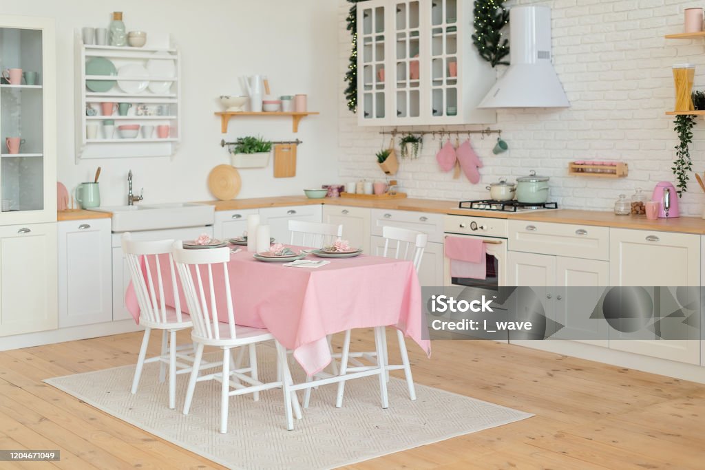 Light modern kitchen with white and rose colours. Light modern kitchen with white and rose colours Apartment Stock Photo