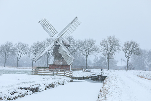 Dutch windmill in snowstorm, Netherlands