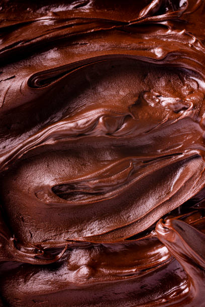 istock creamy dark chocolate background 1204674303