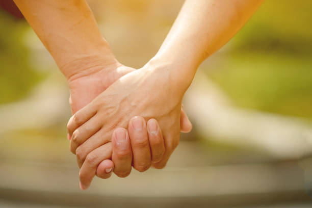 istock Men and women shake hands with love on valentines day 1204675738