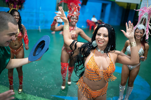 Woman (passista) celebrating and dancing carnival at school carnival