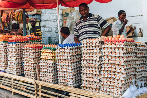 Zanzibar, Tanzania - February 21, 2019: Local african people selling eggs at the market place of Stonetown Zanzibar.