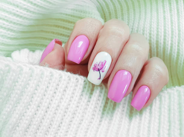 istock female hand beautiful nail manicure sweater 1204682255