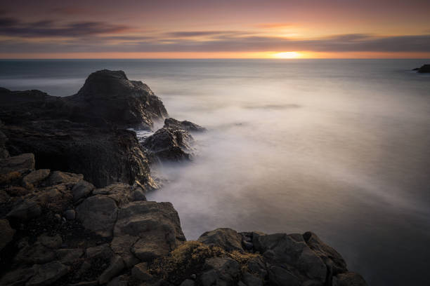 istock Dyrholaey lighthouse over black sand beach in Iceland 1204682657