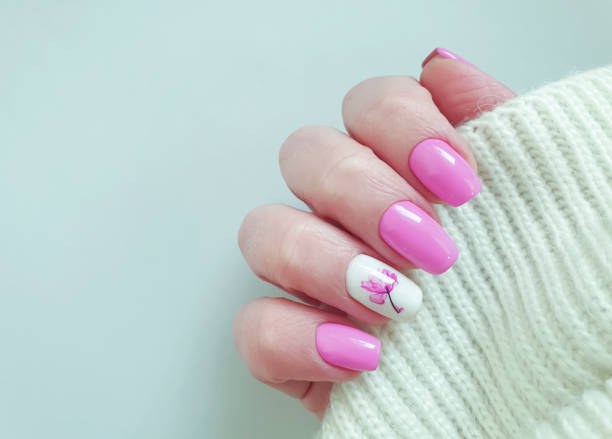 istock female hand beautiful nail manicure sweater 1204683374