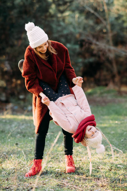istock Mother and daughter have fun in the forest. 1204685118