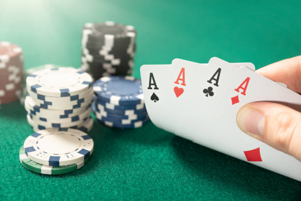 istock Man plays poker in the casino 1204686225