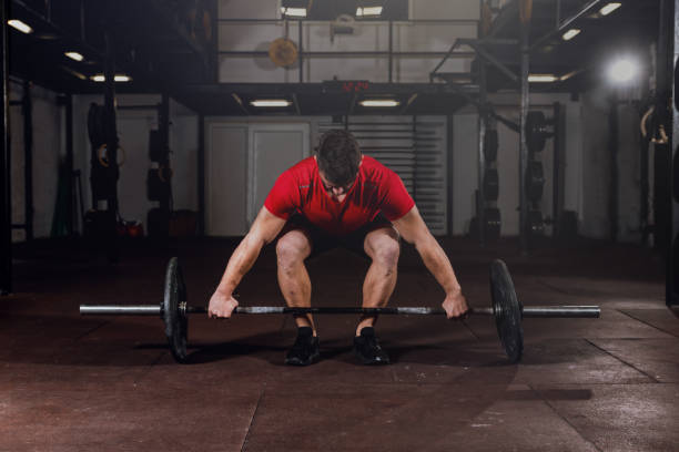 istock Fit and Strong Young Man Preparing for Dead Lift Workout 1204689992