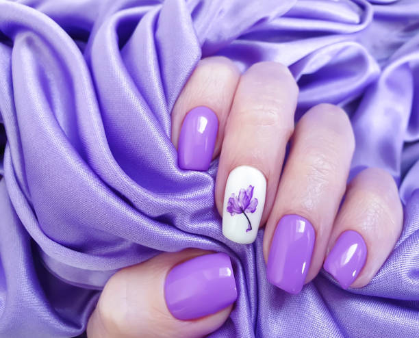 istock female hand beautiful nail manicure silk 1204690377