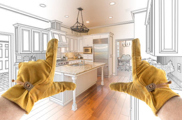 istock Male Contractor Hands Framing Completed Section of Custom Kitchen Design Drawing 1204692969