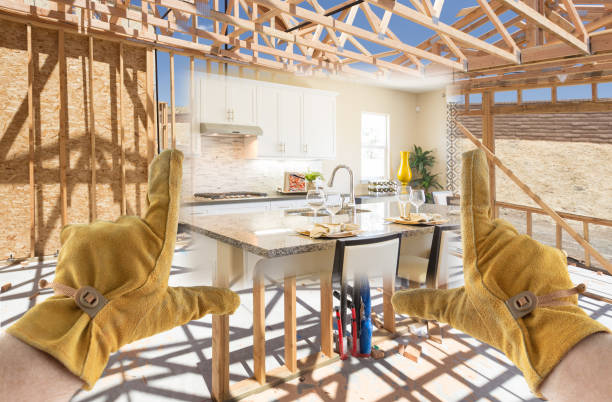 istock Male Contractor Hands Framing Completed Section of Kitchen Being Built 1204693121