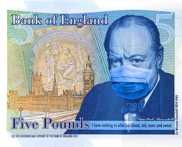 Coronavirus Wuhan Sars illness. Concept: Quarantine in China, 5 British Pound banknote with face mask. stock photo