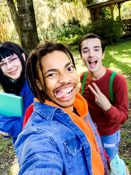 istock Group of university students take a selfie making funny faces 1204694307