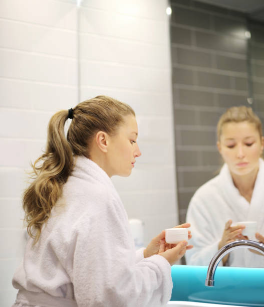 istock Magic anti-aging cream.Applying the cream 1204696140