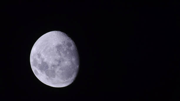 waning gibada moon of white color and with great detail of approach, seen from the southern hemisphere in the middle of the night