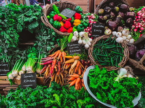 Multi-Colored Food and Flowers at Oranjezicht Farmers Market – taken on mobile phone