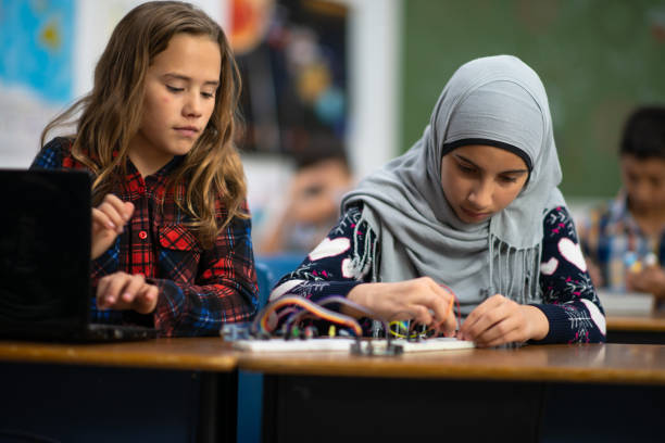 istock Elementary Girls Working on a STEM Project stock photo 1204702619