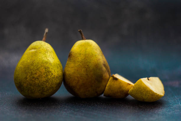 istock Whole Pears And Slices Of Pears 1204703543