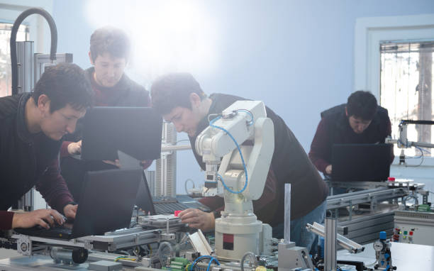 istock Picture collage of the same engineer in different positions who is trying to programming robot arm and smart factory prototype 1204706531