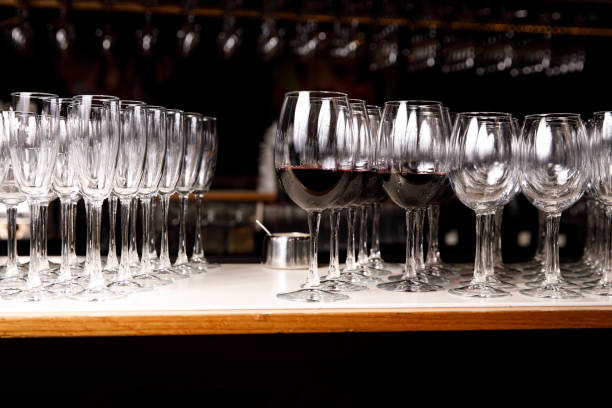 istock Empty glasses and glasses with red wine at event catering. 1204712152