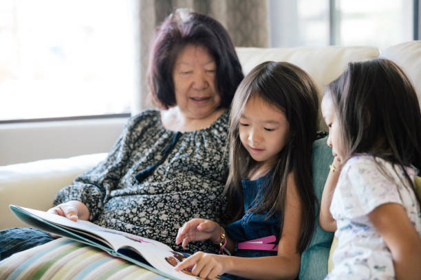 istock Reading a book with grandmother 1204716141