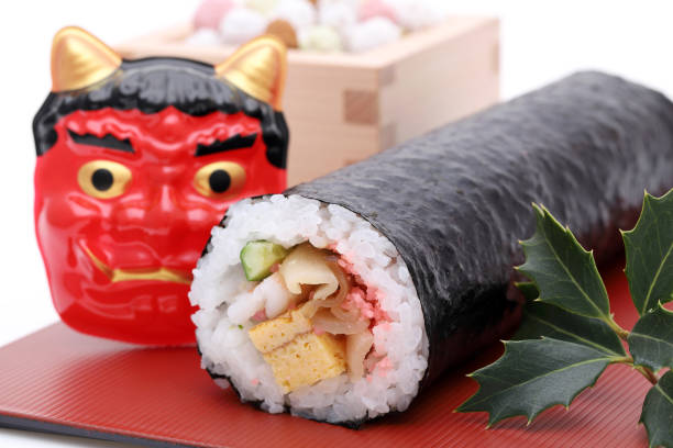 Japanese Setsubun event, Ehomaki sushi and Mask of Oni stock photo
