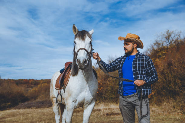 istock Man enjoying with his horse 1204721633