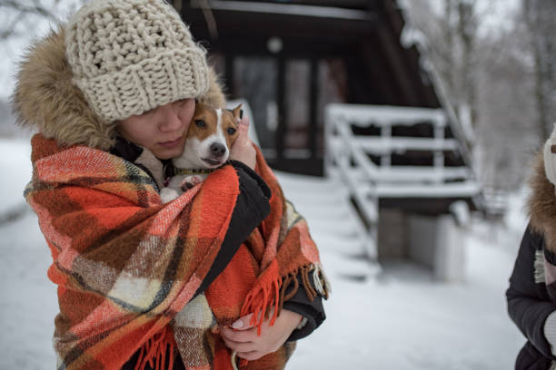 istock two young women spending time in nature with their dog 1204722753