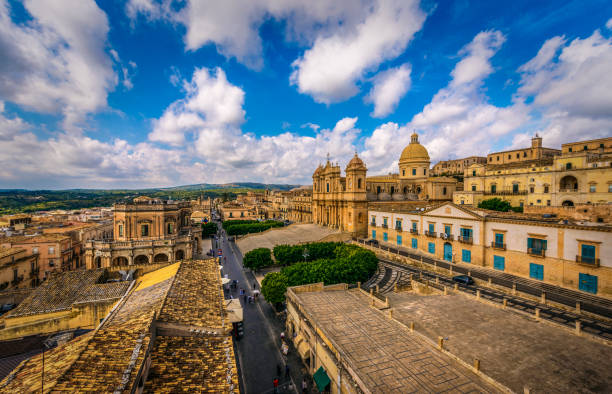 World Heritage Street In Noto Beautiful World Heritage Street and Buildings in Noto on a cloudy day. noto sicily stock pictures, royalty-free photos & images