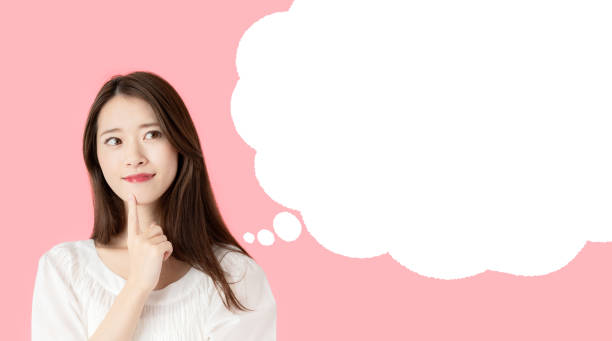 istock Young asian girl with speech balloon. 1204732726