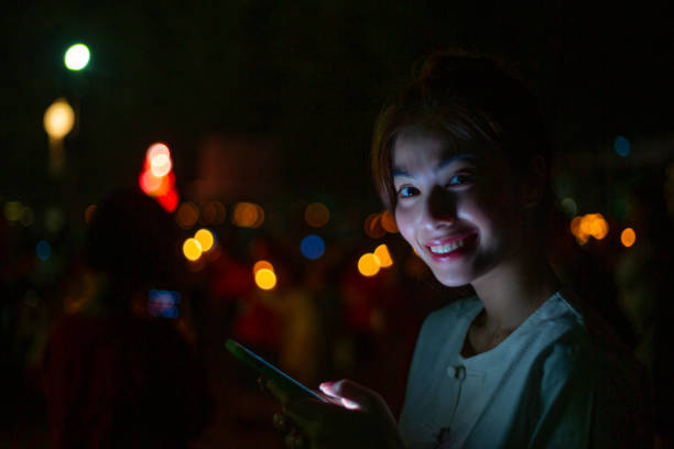 istock Asian woman using smart phone in outdoor 1204736292