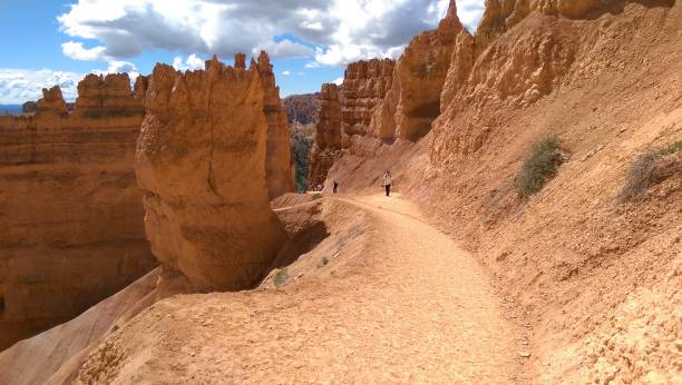 istock Hikers enjoy formations at Bryce Canyon, Utah 1204736455