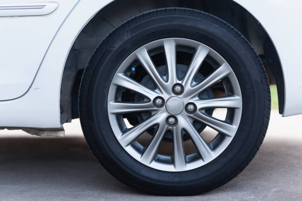 istock close up wheels white car, transportation concept 1204750562