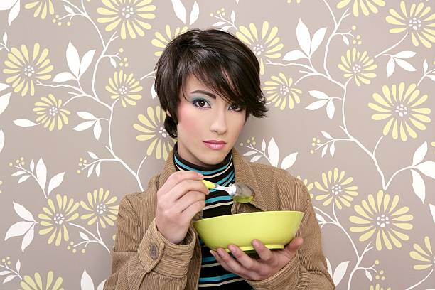 breakfast cereal bowl soup dish retro woman vintage  corduroy jacket stock pictures, royalty-free photos & images