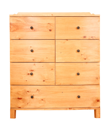 Contemporary pine chest of drawers isolated against a white background with clipping path