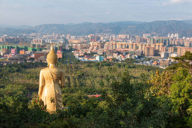 Jinghong, China - January 2, 2020: Panoramic view of jinghong from Mengle Temple with Giant Buddha in Xishuangbanna - Yunnan Jinghong, China - January 2, 2020: Panoramic view of jinghong from Mengle Temple with Giant Buddha in Xishuangbanna - Yunnan xishuangbanna stock pictures, royalty-free photos & images