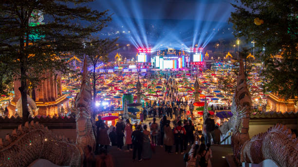 Gaozhuang Night Market at night with tourist walking by Jinghong, China - December 30, 2019: Gaozhuang Night Market at night with tourist walking by xishuangbanna stock pictures, royalty-free photos & images