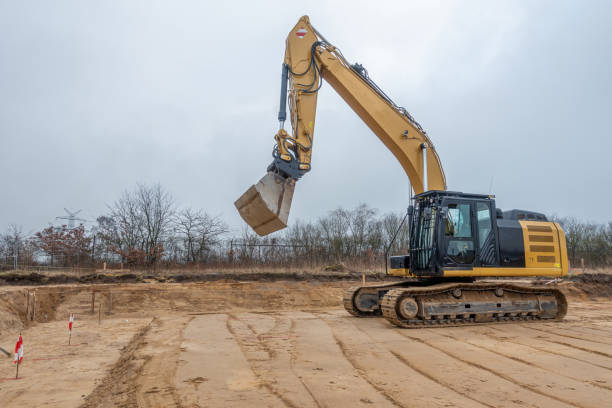 istock a building site there is a yellow excavator preparing the ground for foundations 1204754885