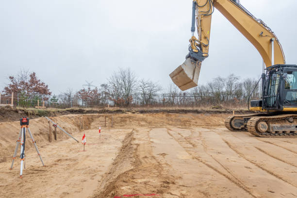 istock a building site there is a yellow excavator preparing the ground for foundations 1204754892